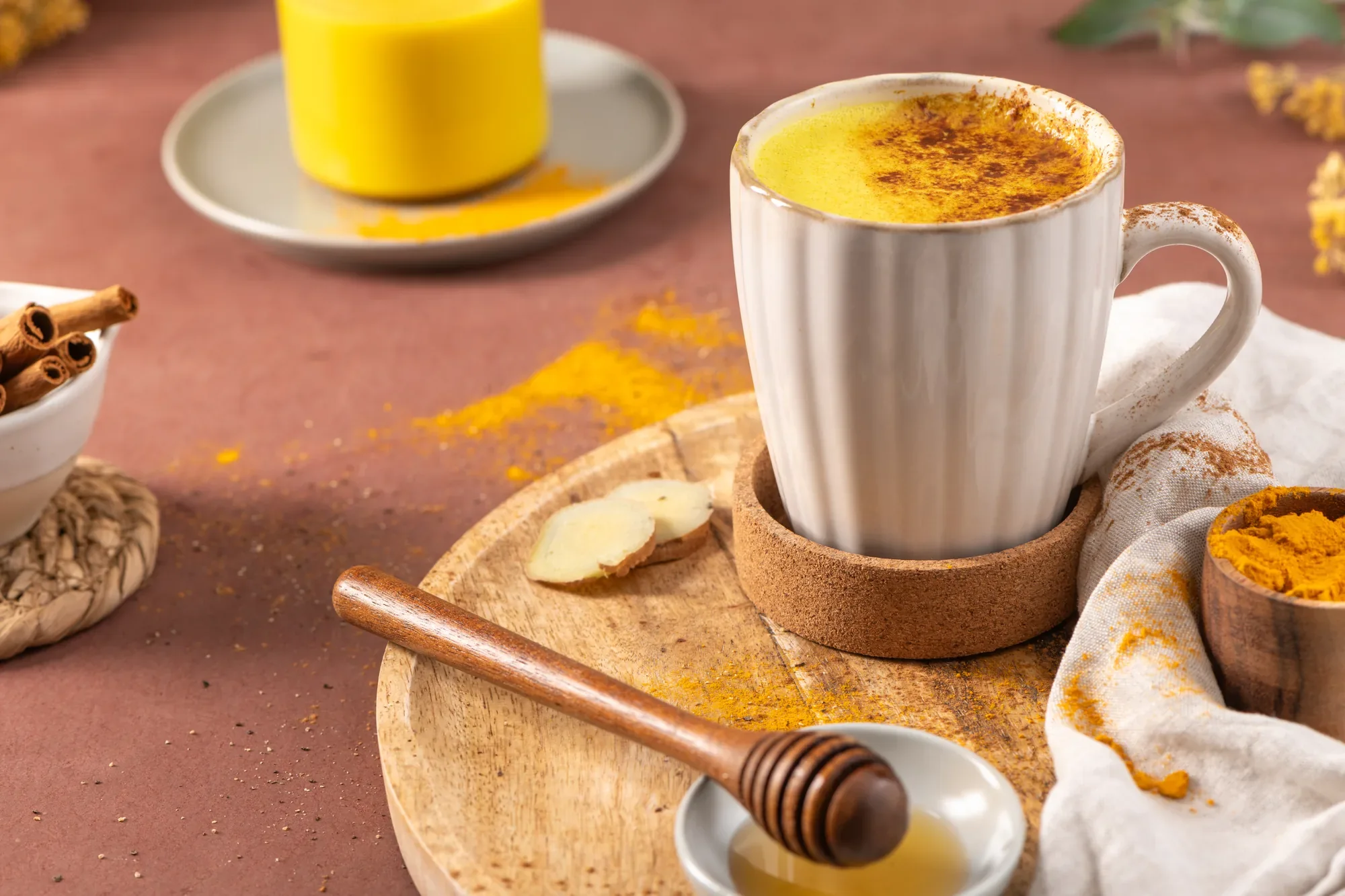 A golden spiced drink with ginger and cinnamon